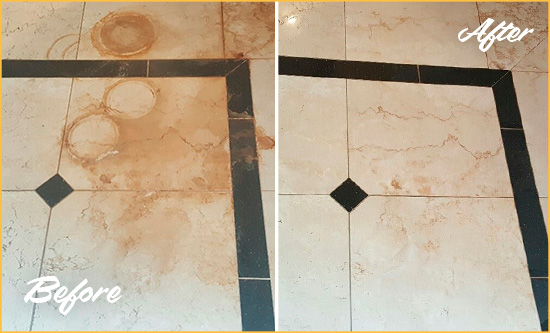 Before and After Picture of a Queens Hard Surface Restoration Service on a Marble Floor to Eliminate Rust Stains